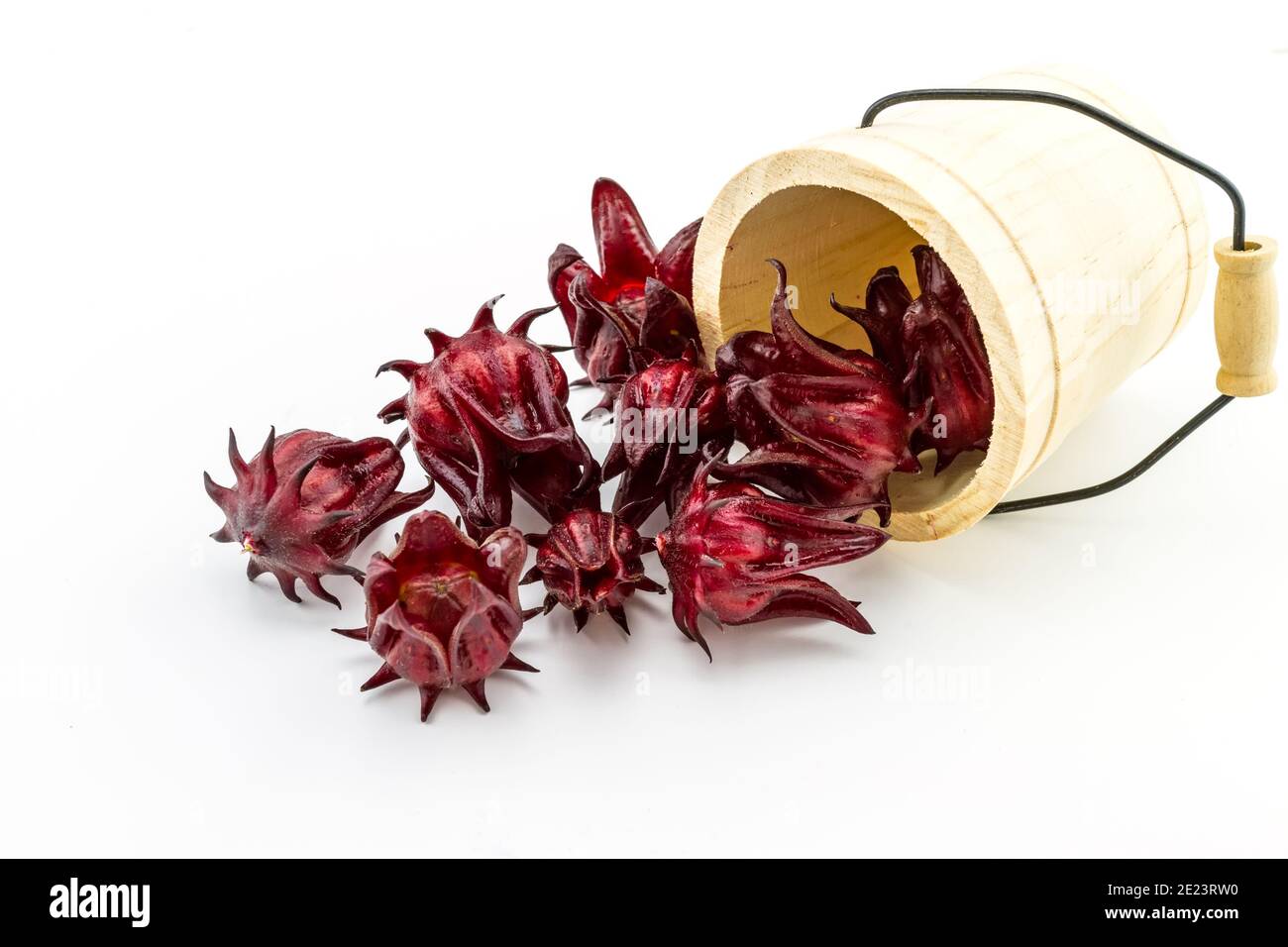 Hibiscus sabdariffa or roselle fruits in wooden box  on white background. Stock Photo