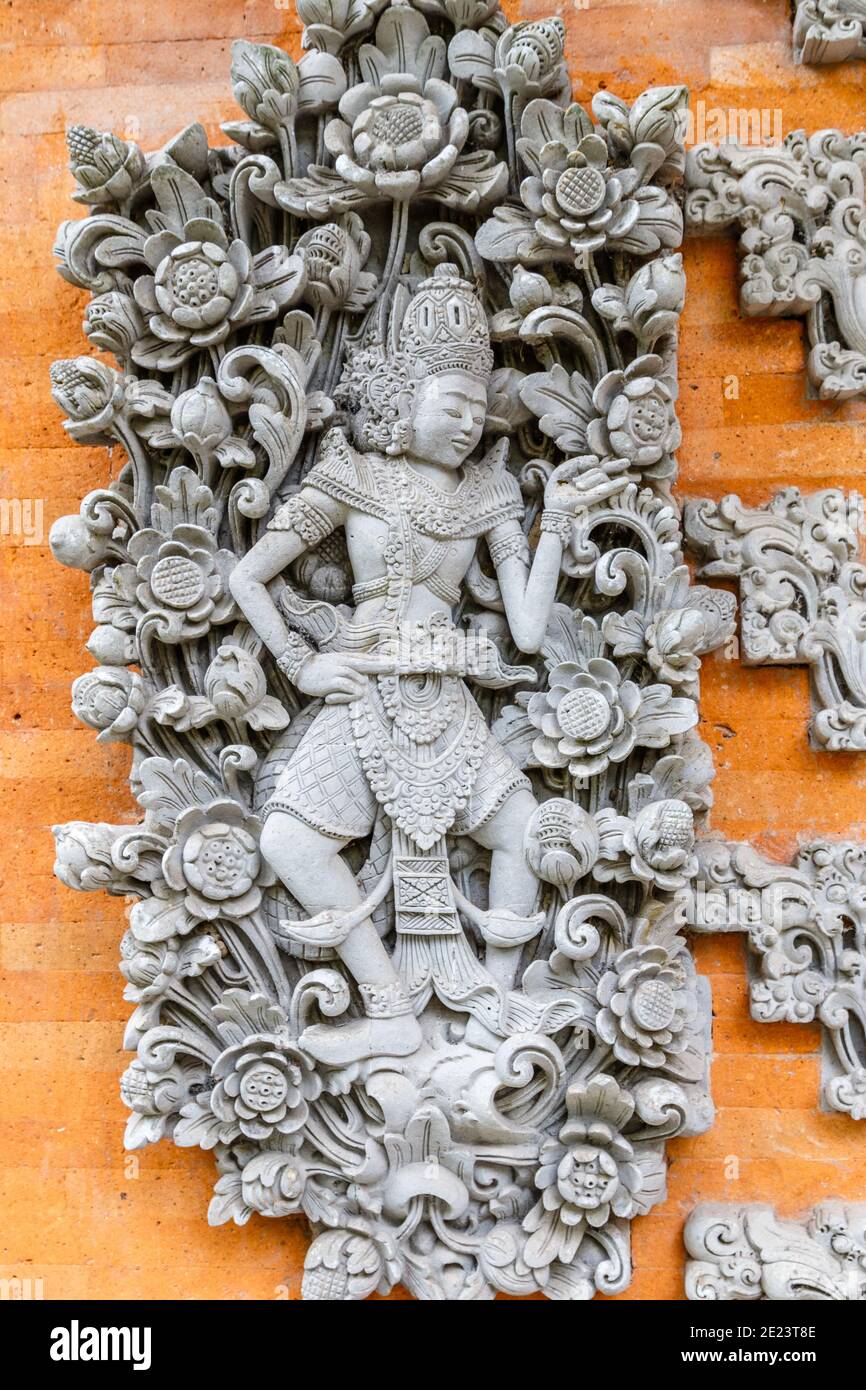 Traditional Balinese stone carving, Ubud, Gianyar, Bali, Indonesia. Vertical image. Stock Photo