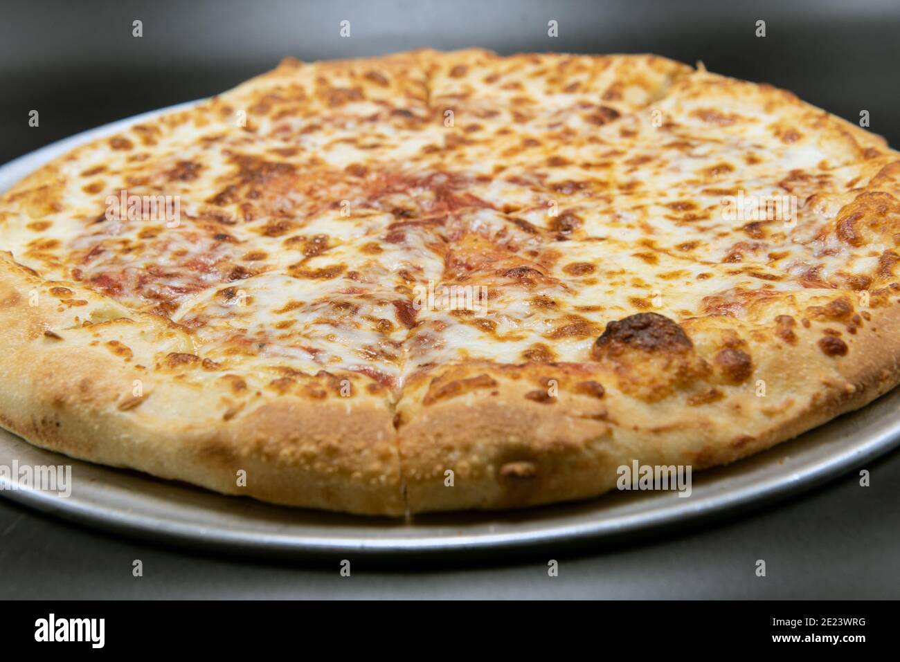 Cheese pizza for that plain flavor that many picky eaters prefer. Stock Photo