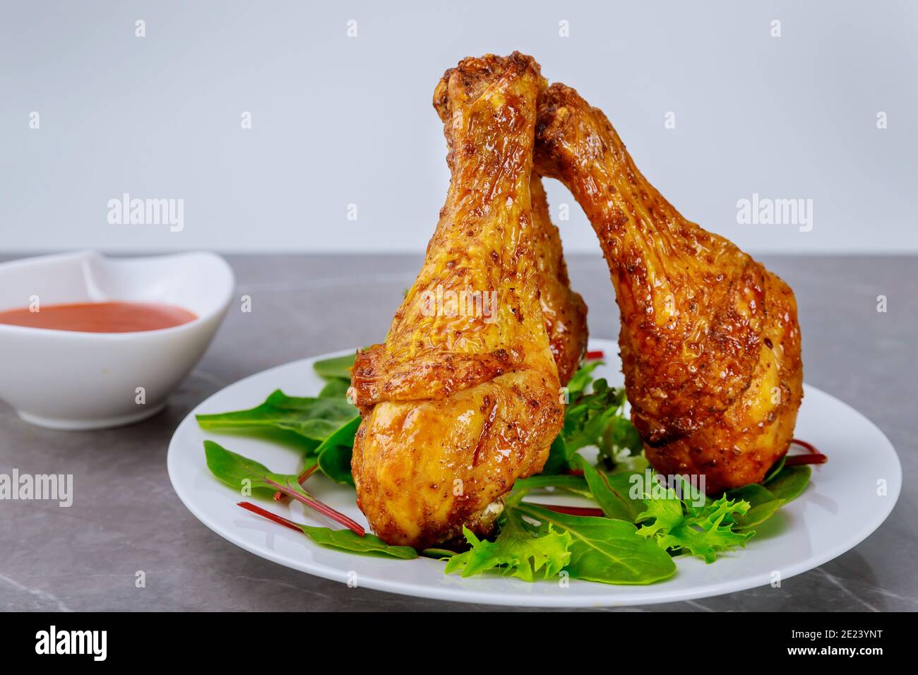 Grilled chicken drumsticks marinated with buffalo sauce. Close up Stock