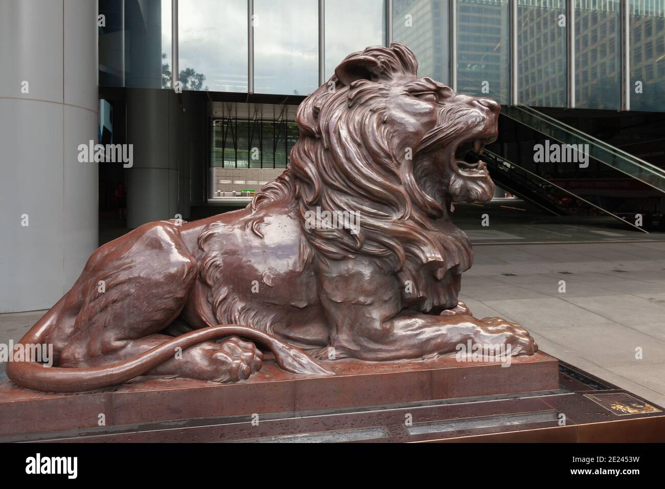 Hong Kong - July 15, 2017: Bronze lion statue at the entrance of HSBC bank Office in Hong Kong central district Stock Photo