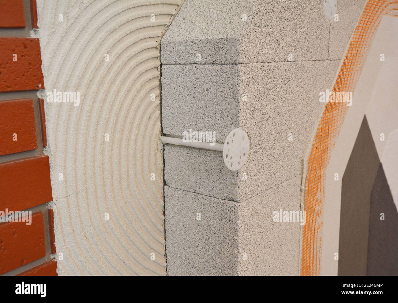 Crosssection view of brick house insulated wall construction with