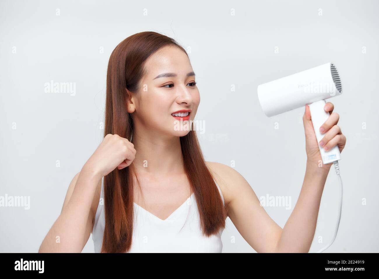 Beautiful Smiling Woman Drying Healthy Long Straight Hair Using Hair