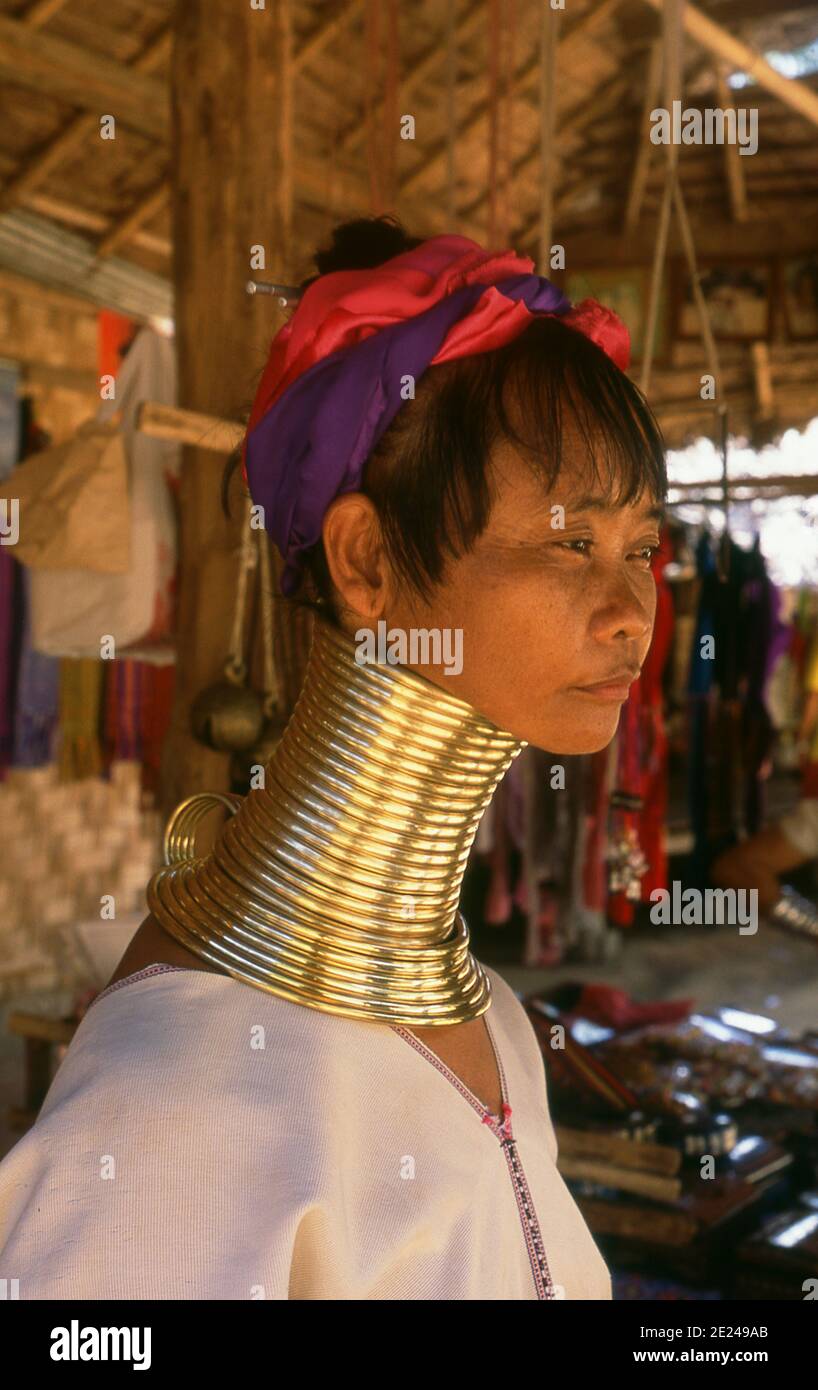 Thailand: A Padaung (Long Neck Karen) woman in her neck rings in a village near Mae Hong Son. The Padaung or Kayan Lahwi or Long Necked Karen are a subgroup of the Kayan, a mix of Lawi, Kayan and several other tribes. Kayan are a subgroup of the Red Karen (Karenni) people, a Tibeto-Burman ethnic minority of Burma (Myanmar). Stock Photo