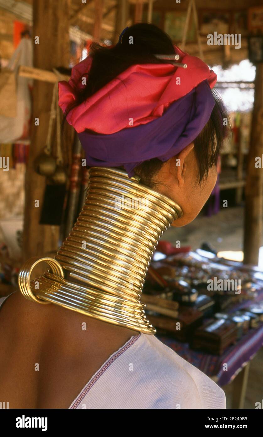 Thailand: A Padaung (Long Neck Karen) woman in her neck rings in a village near Mae Hong Son. The Padaung or Kayan Lahwi or Long Necked Karen are a subgroup of the Kayan, a mix of Lawi, Kayan and several other tribes. Kayan are a subgroup of the Red Karen (Karenni) people, a Tibeto-Burman ethnic minority of Burma (Myanmar). Stock Photo
