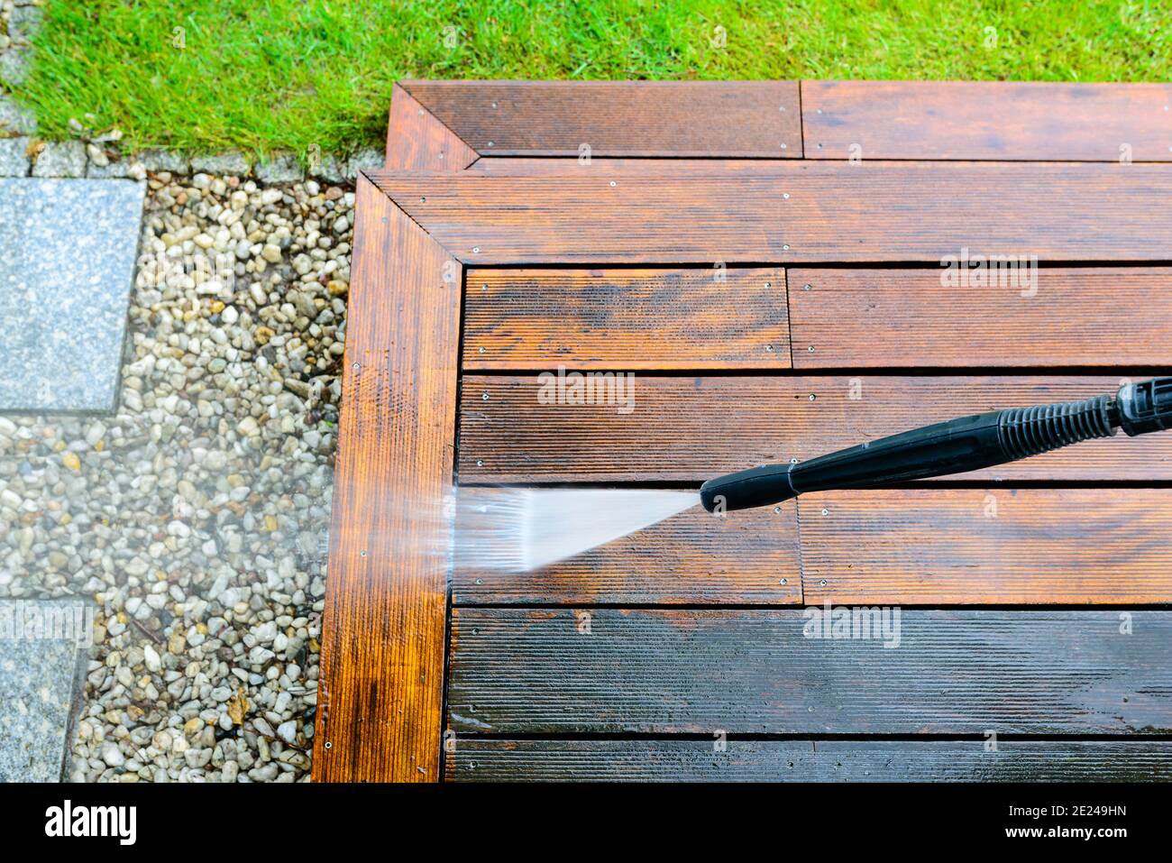 cleaning terrace with a power washer high water pressure cleaner on