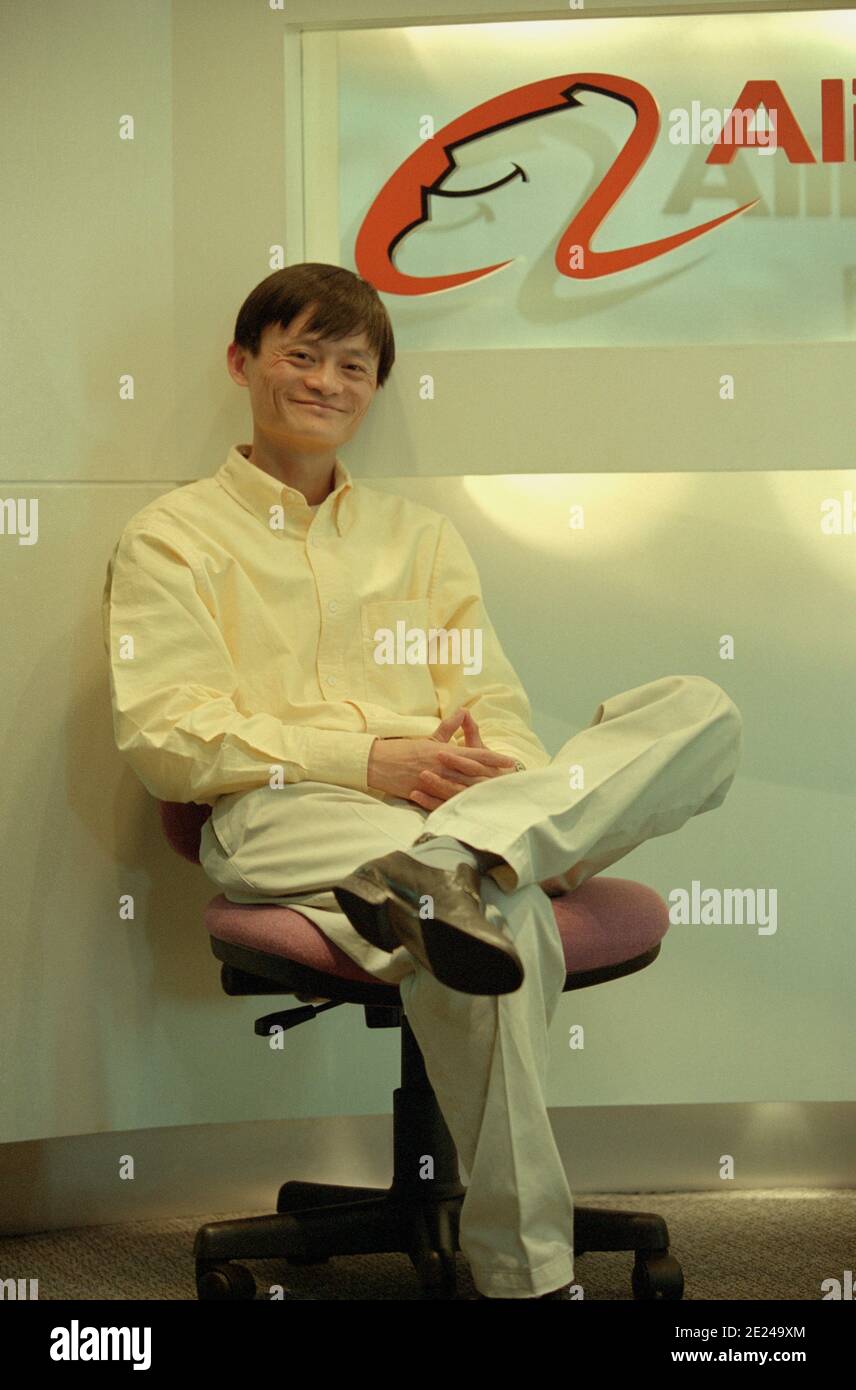 Jack Ma, the co-founder of Alibaba Group, poses in front of the Alibaba  logo when Alibaba opens an office in Beijing, China in 2000 Stock Photo -  Alamy