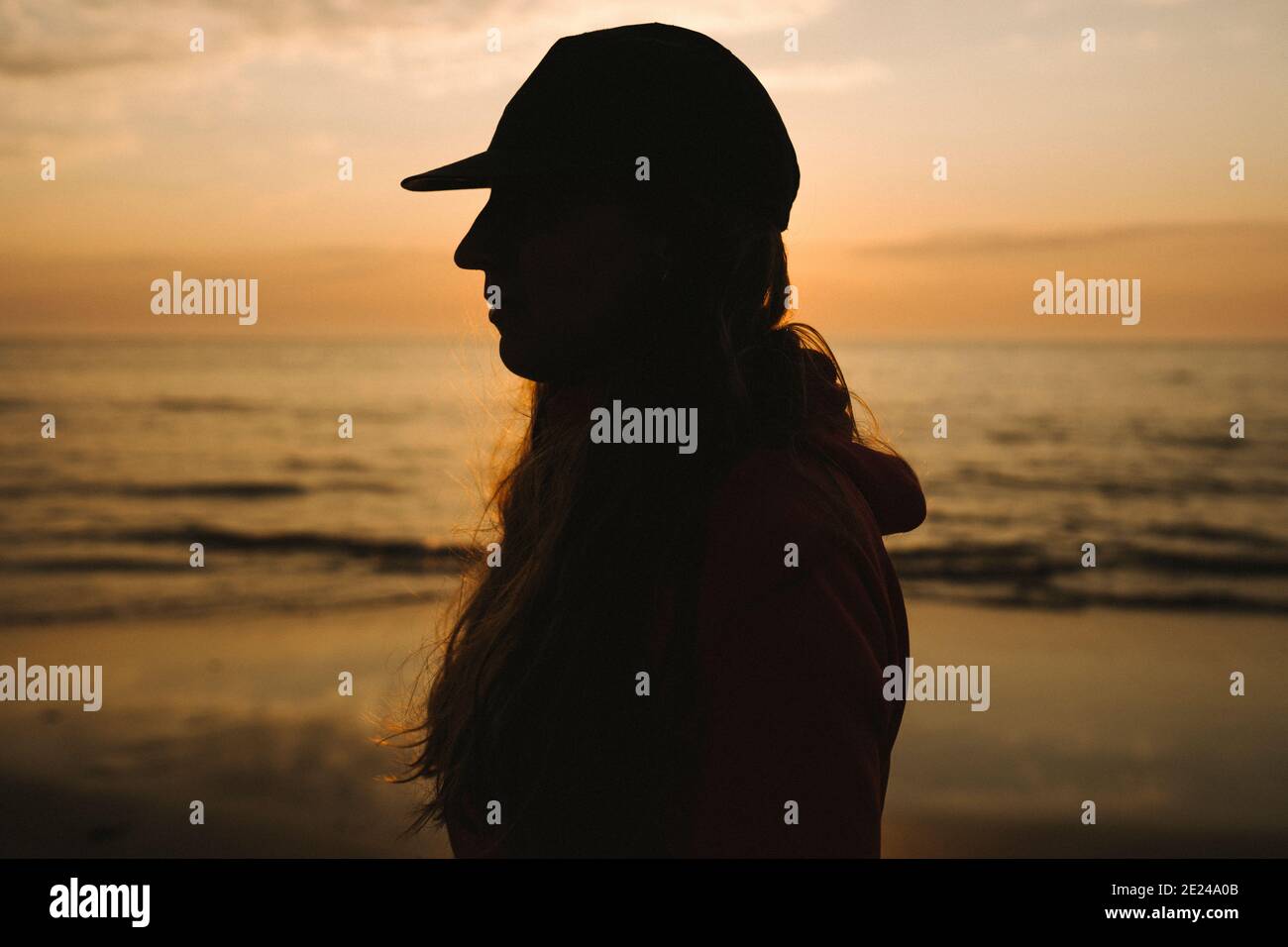 Silhouette of woman, sea on background Stock Photo