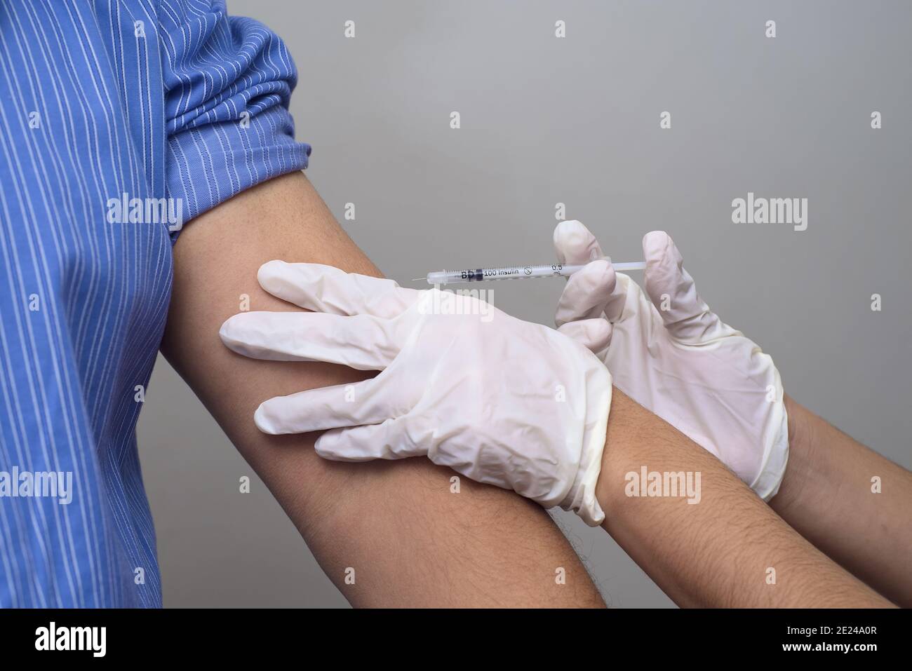 Nurse making an insulin injection to the patient suffering from ...