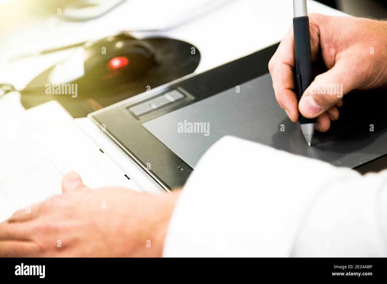 Graphic designer working on drawing board Stock Photo