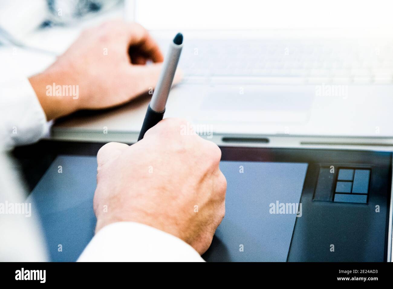 Graphic designer working on drawing board Stock Photo