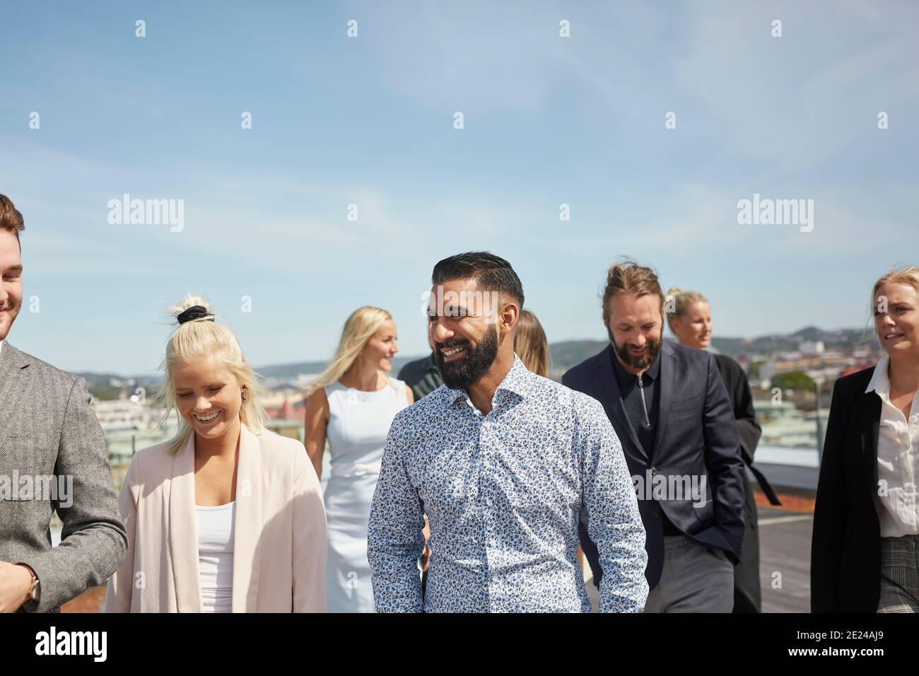 Coworkers talking on terrace Stock Photo
