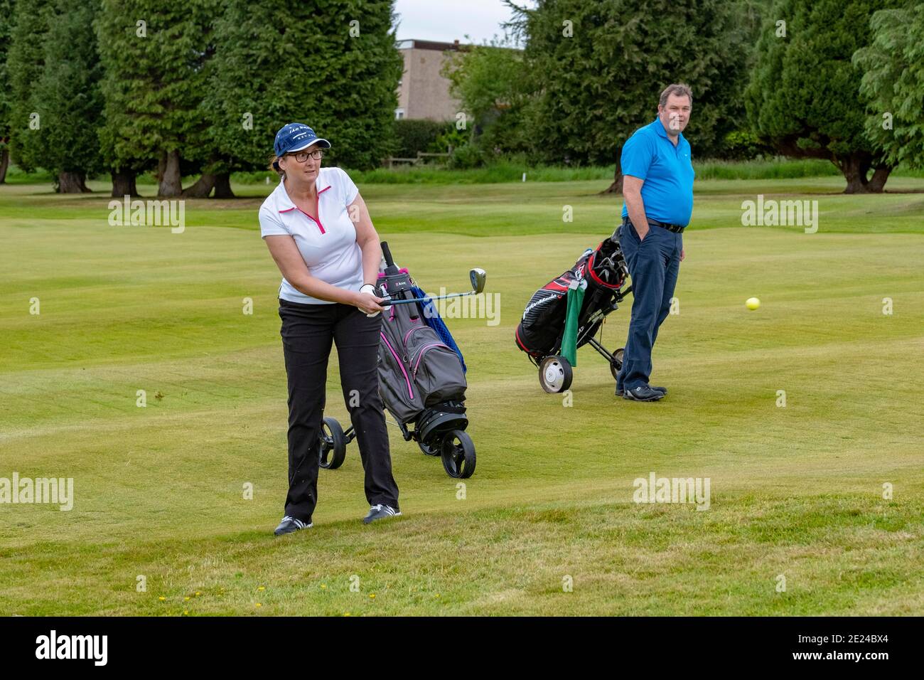 people leisurely playing golf Stock Photo