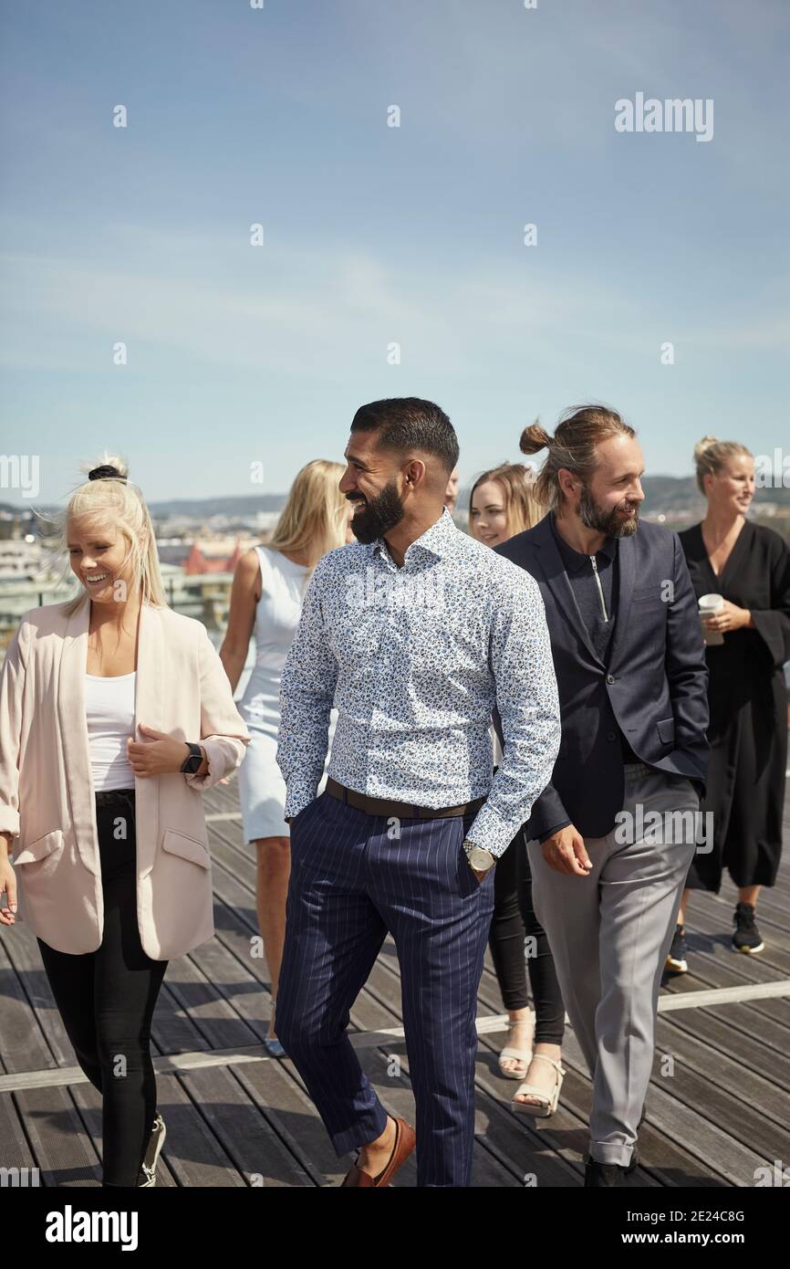 Coworkers talking on terrace Stock Photo