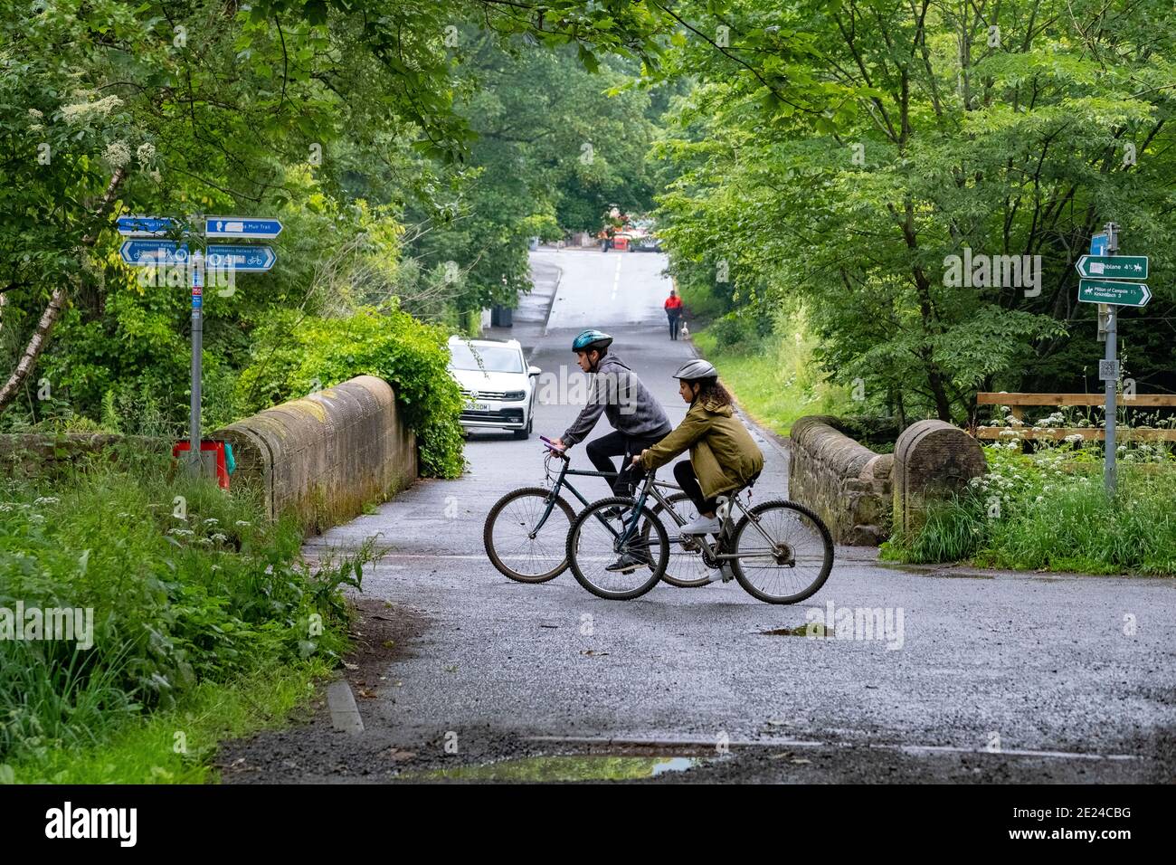 People cycling along roads and pathways Stock Photo