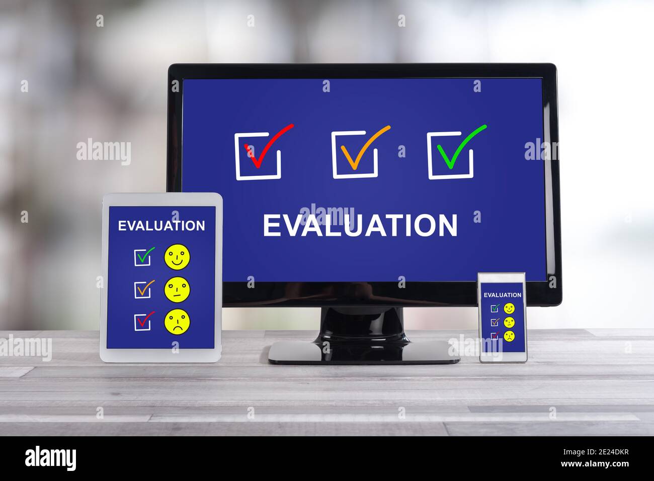 Evaluation concept shown on different information technology devices Stock Photo