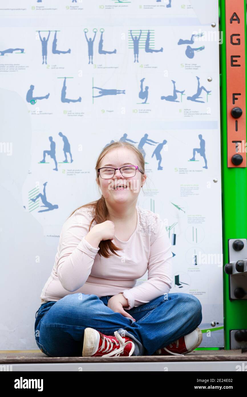 Girl on playground looking at camera Stock Photo