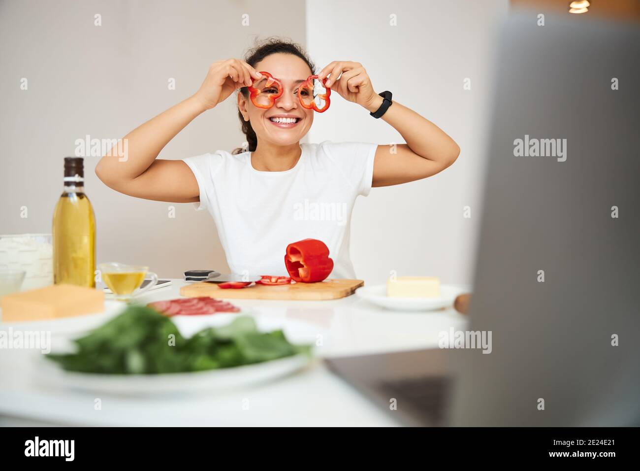 Food blogger having fun during the online cooking process Stock Photo ...