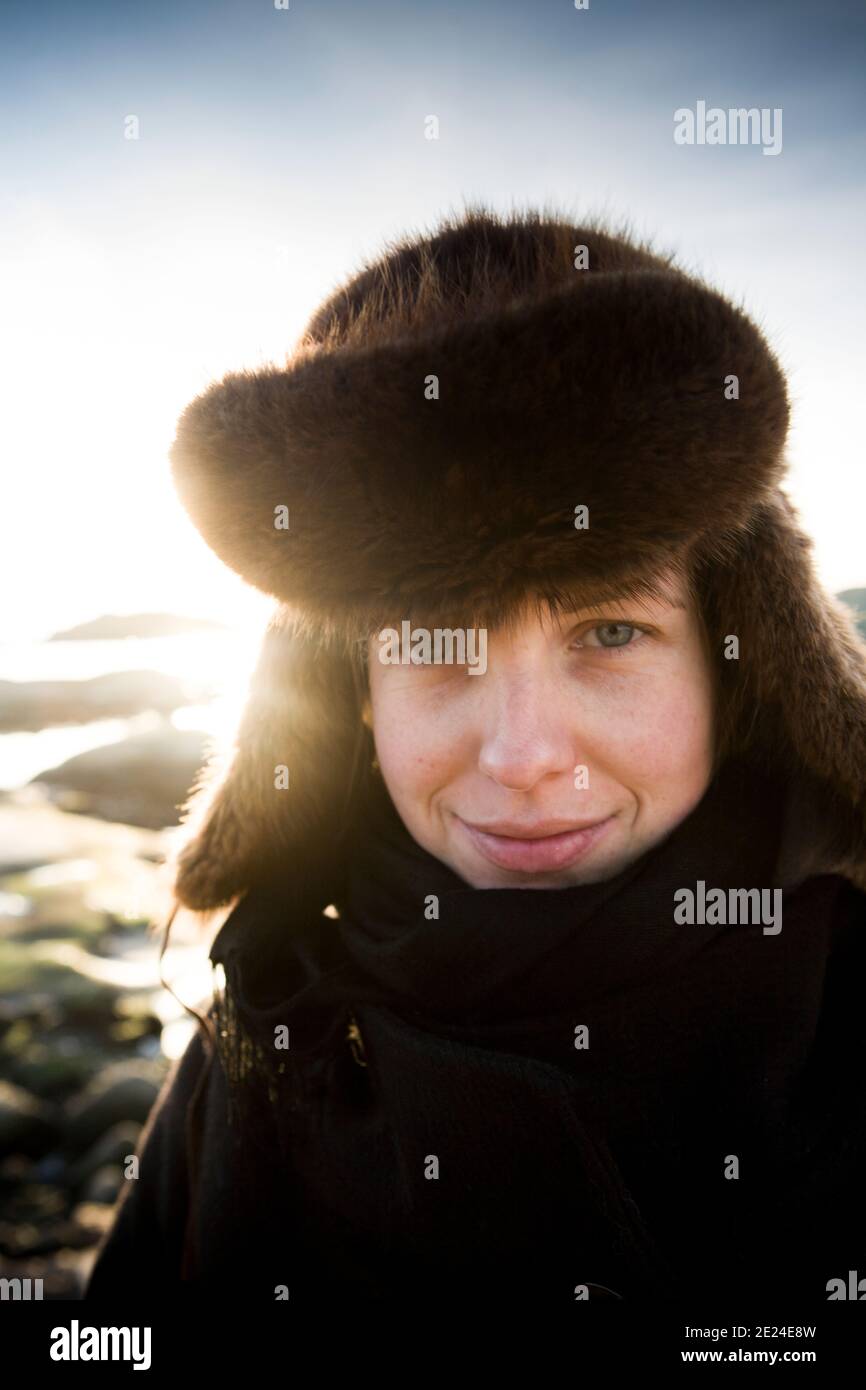 Portrait of woman wearing fur hat Stock Photo