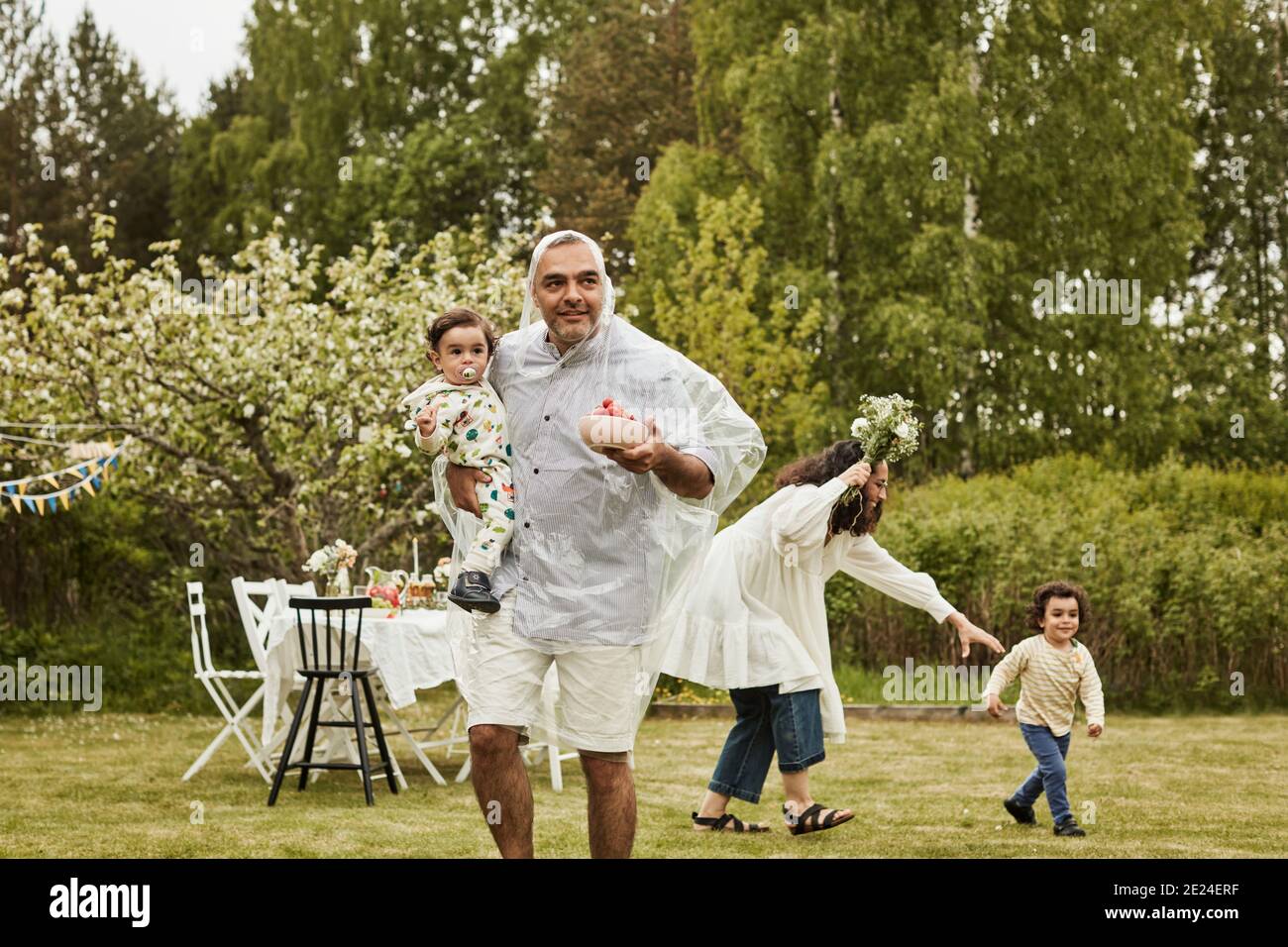 Happy family with kids in garden Stock Photo