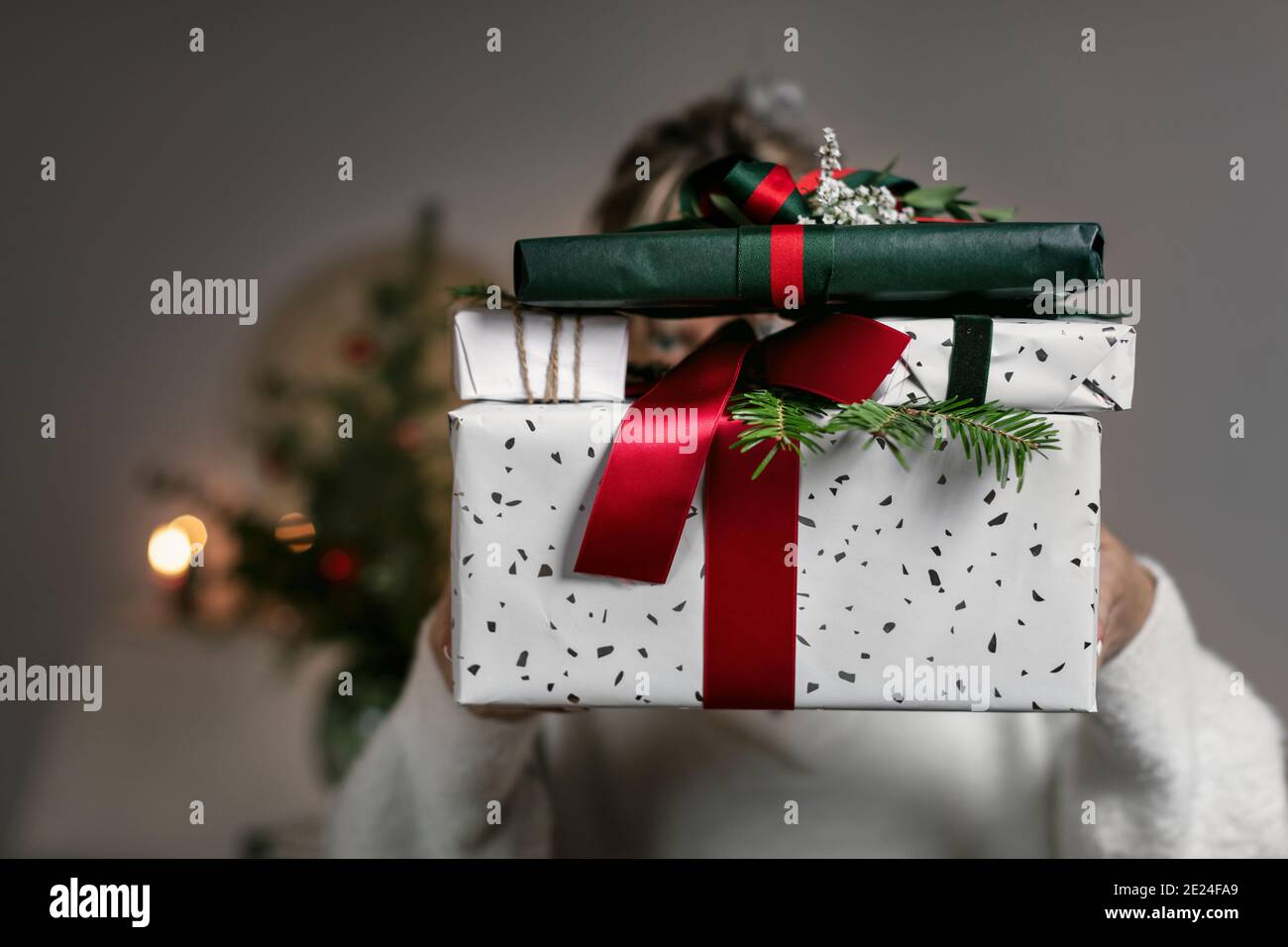 Hands holding Christmas present Stock Photo