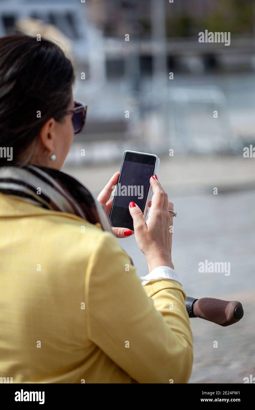 Woman mature phone hand rear view hi-res stock photography and images ...
