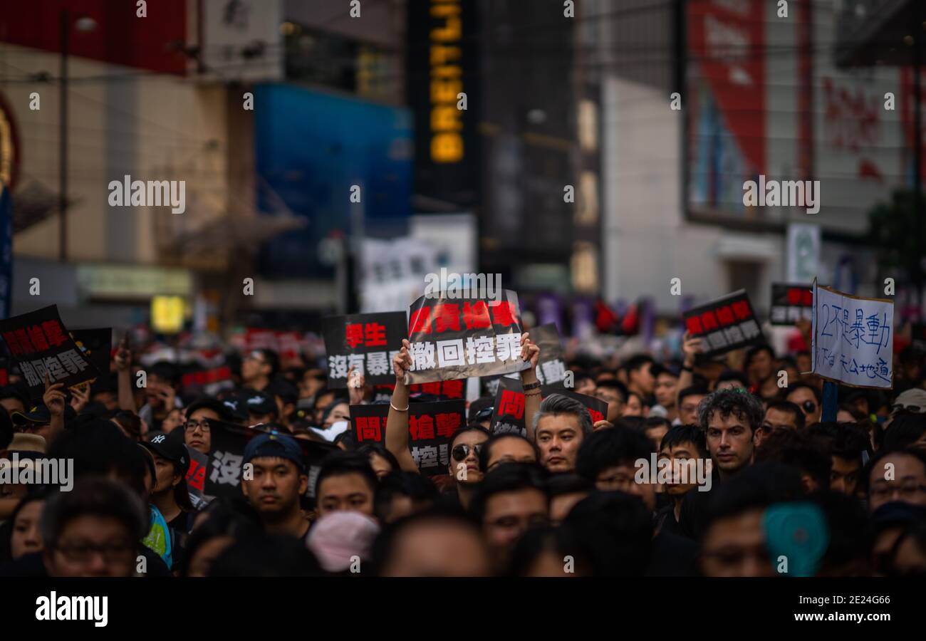 HONG KONG, CHINA - Jun 16, 2019: HONG KONG - JUN 16, 2019: Anti-Extradition Bill Protest in Hong Kong on 16 June 2019. Holding poster of 'Shooting acc Stock Photo