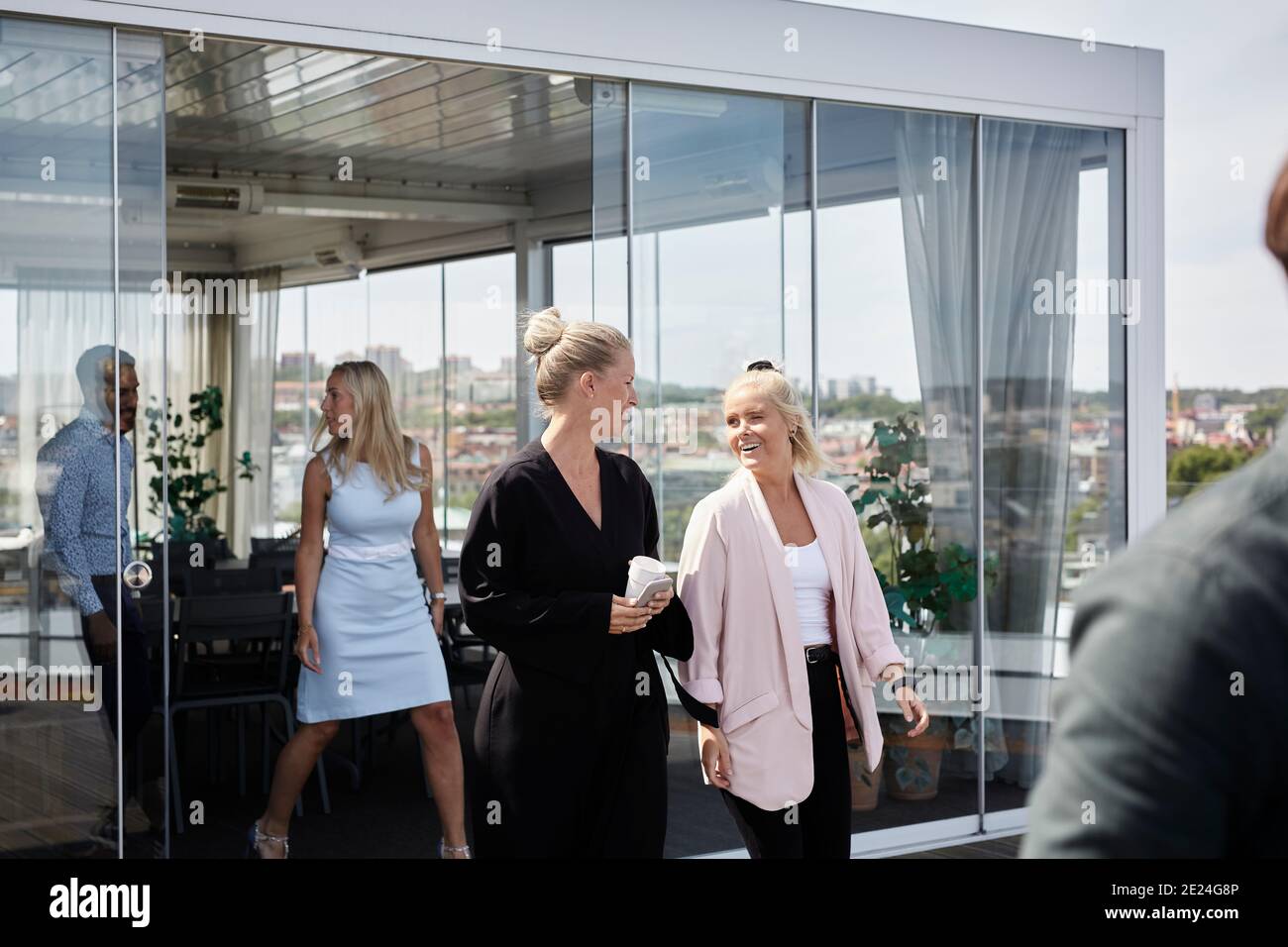 Coworkers talking during coffee break Stock Photo