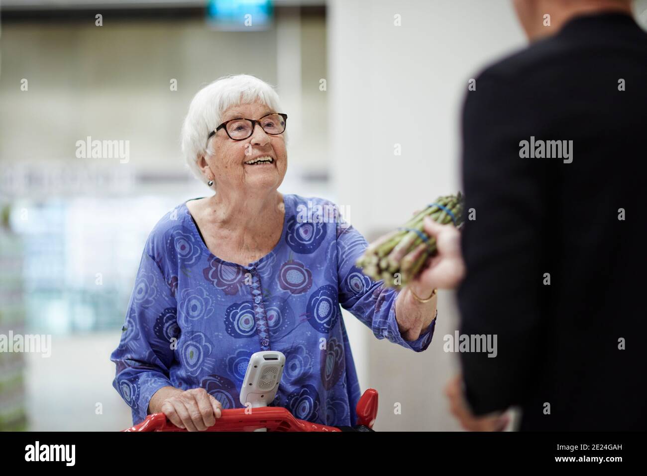 Old woman shopping trolley hi-res stock photography and images - Alamy