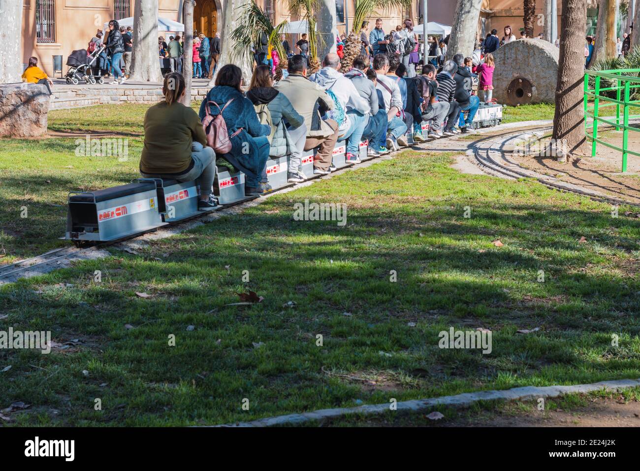 Cornellà de Llobregat, Spain, February 2 2020: miniature train circulating with people climbing on top Stock Photo