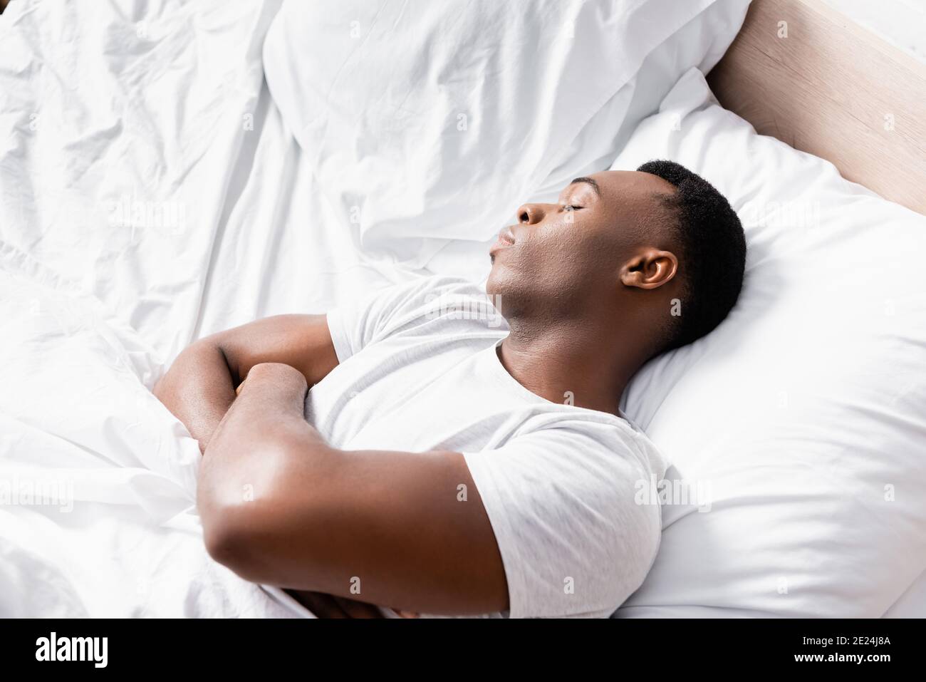 Businessman sleeping arms crossed hi-res stock photography and images
