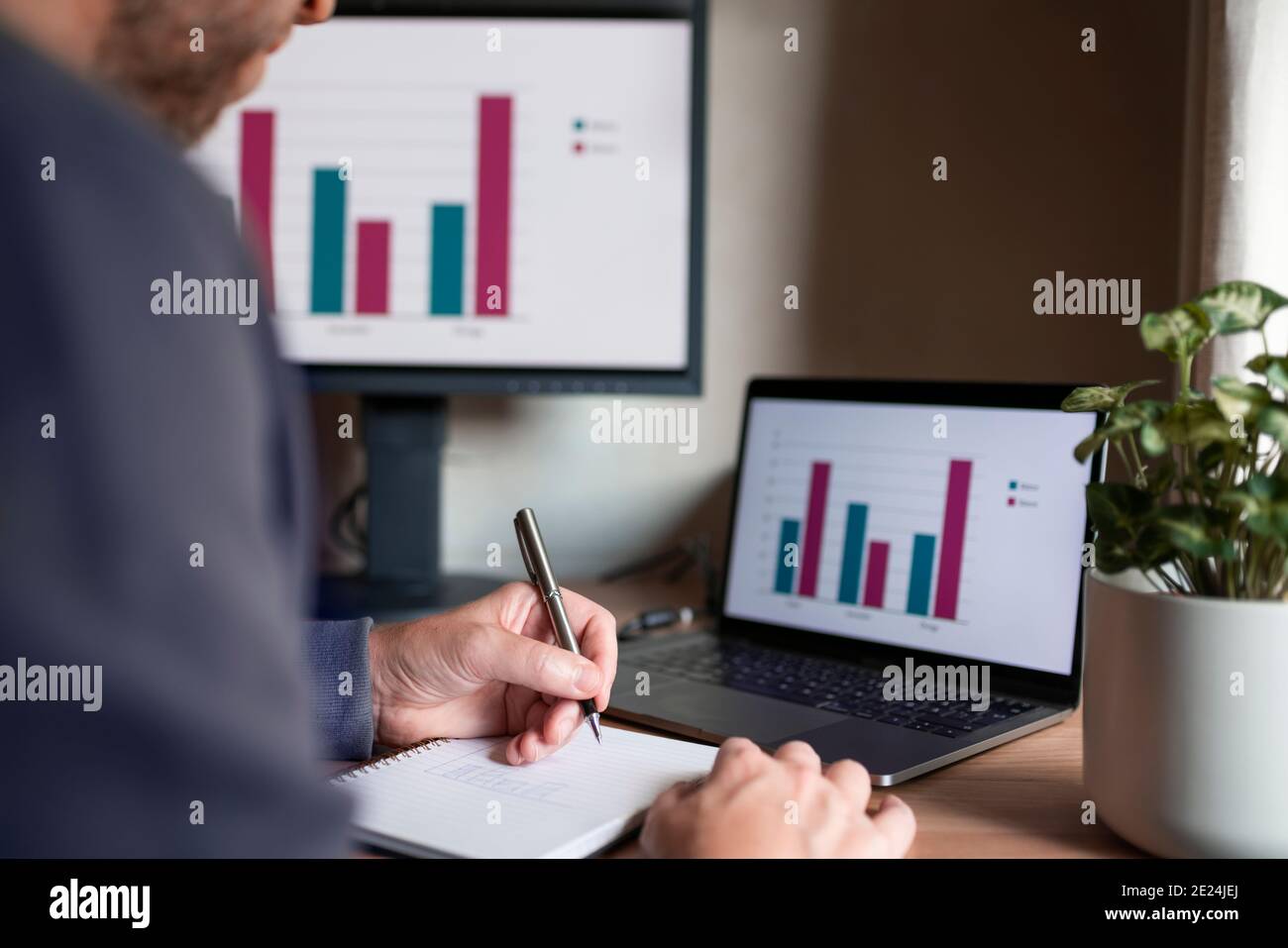 Mid section of man working from home Stock Photo