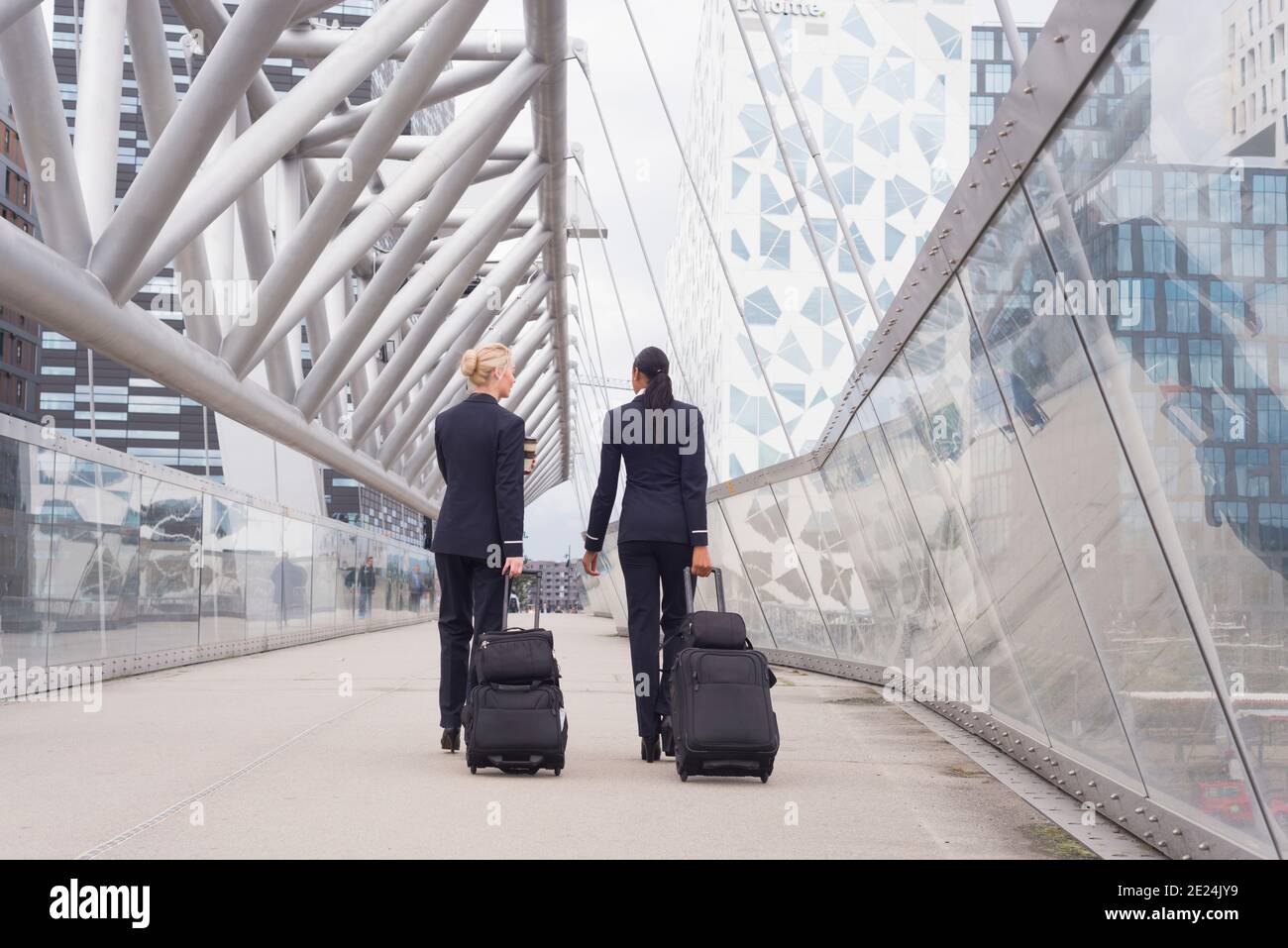 Two female flight attendants at airport Stock Photo Alamy