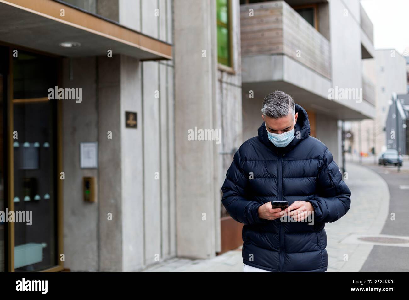 Man holding mask face hi-res stock photography and images - Alamy