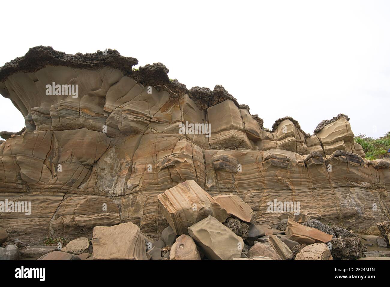 The large yellow rocks show signs of wind erosion. Xiaoyeliu has a ...