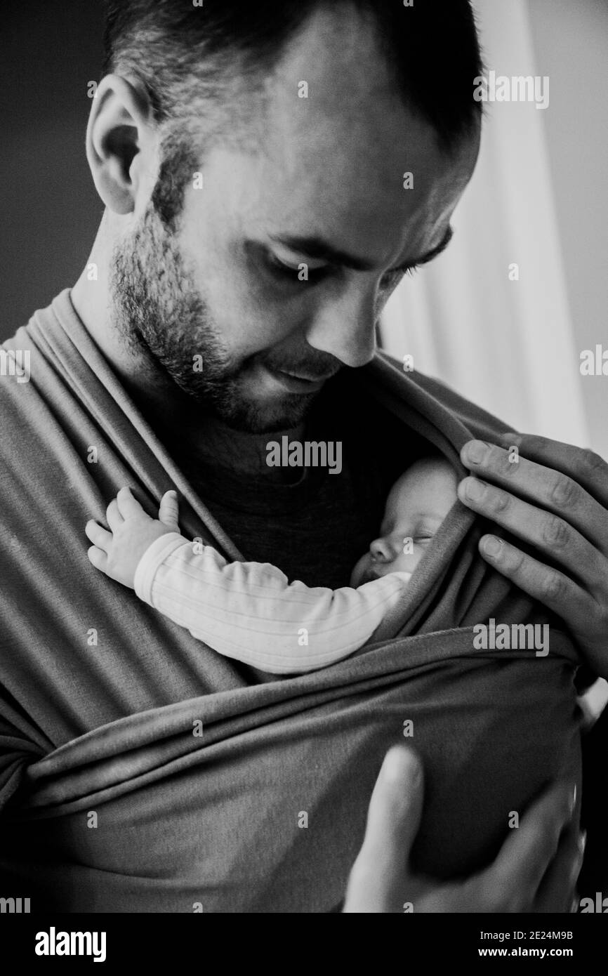 Father carrying baby in baby sling Stock Photo Alamy