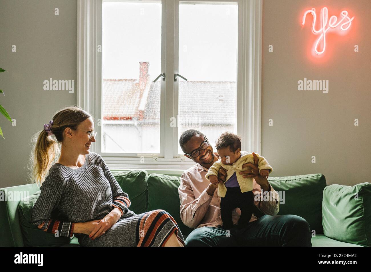 Woman sitting on sofa several hi-res stock photography and images - Alamy