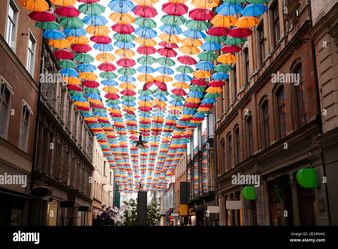 Colorful umbrellas above street Stock Photo
