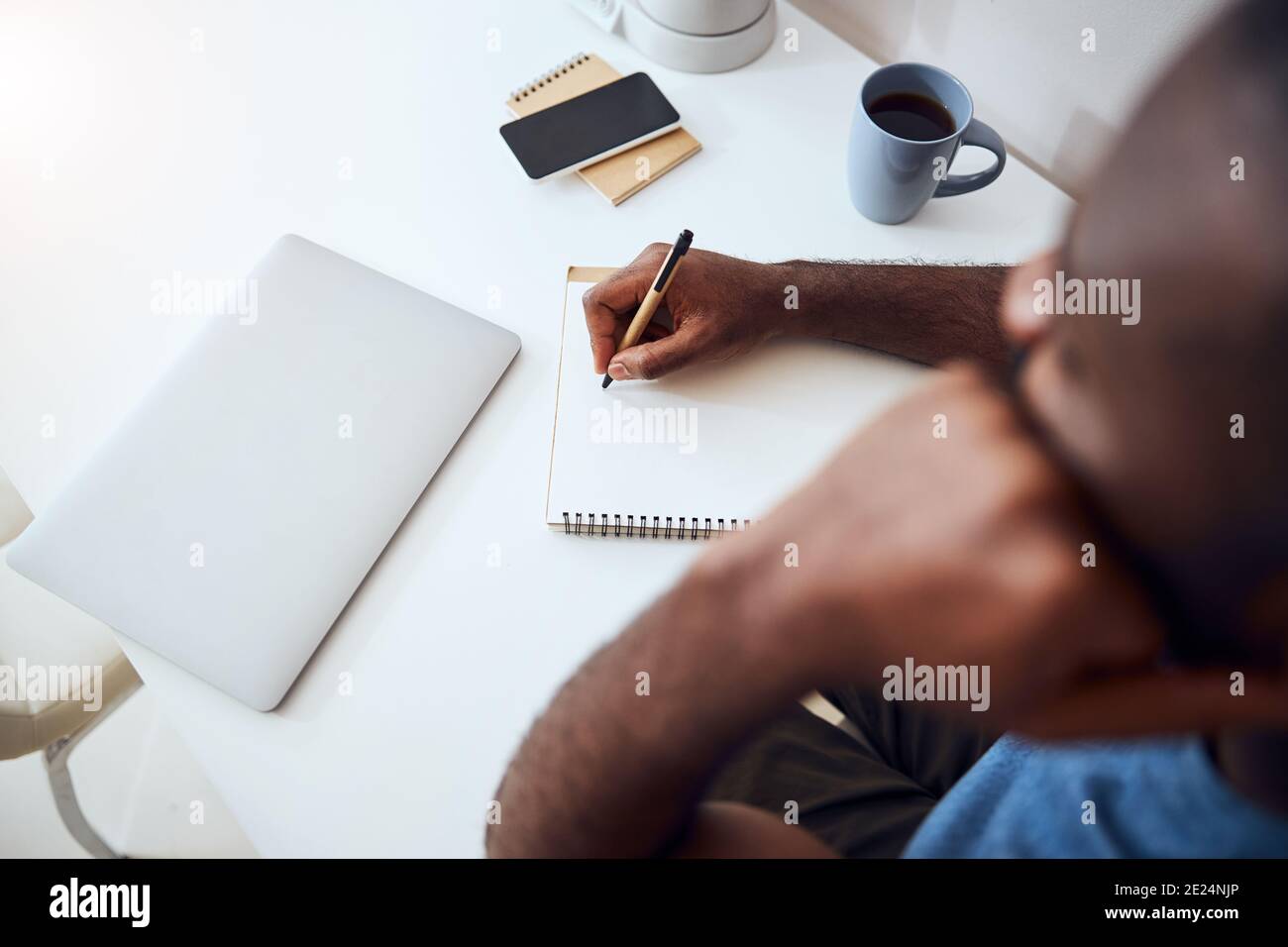 Multiethnic person coming up with things for writing Stock Photo