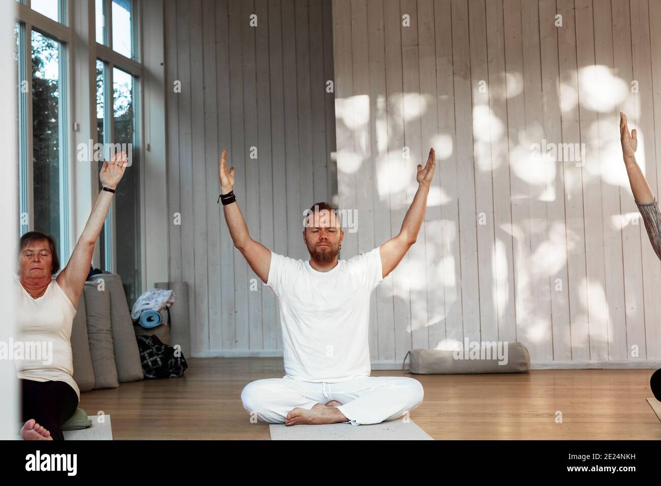 People practicing yoga in class Stock Photo