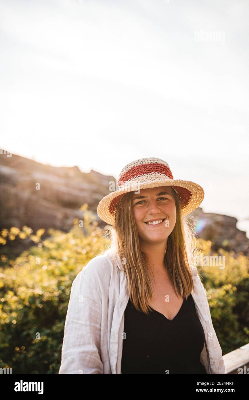 Smiling woman wearing hat Stock Photo