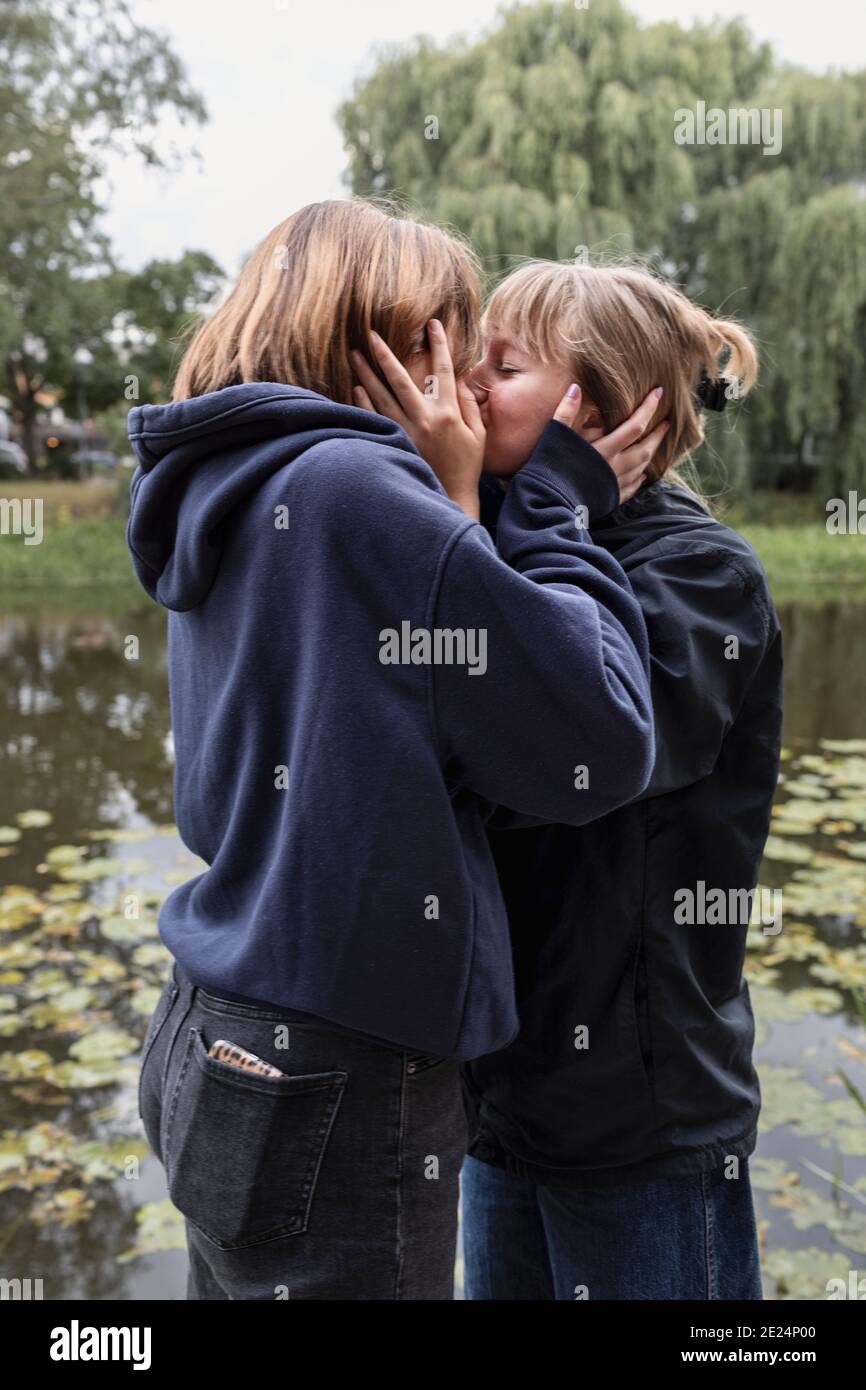 Two teenage girls kissing Stock Photo