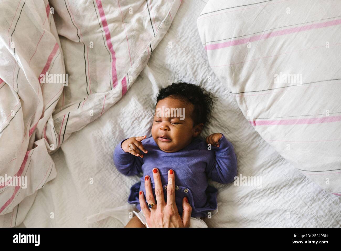 Baby sleeping on bed Stock Photo Alamy