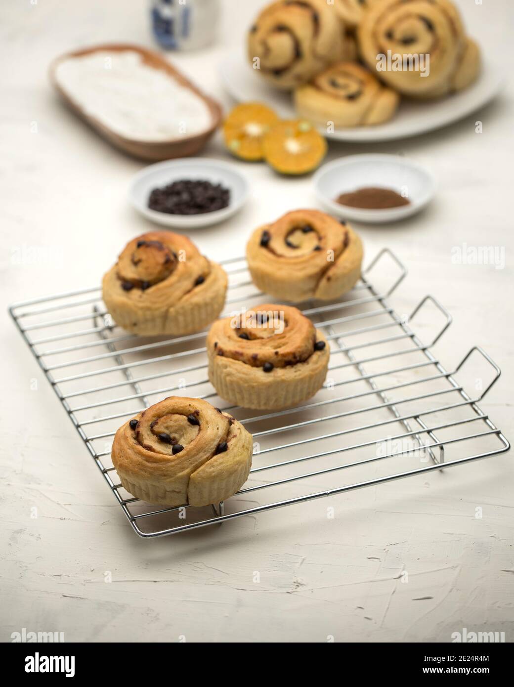 Cinnamon Rolls on a wire cooling rack Stock Photo