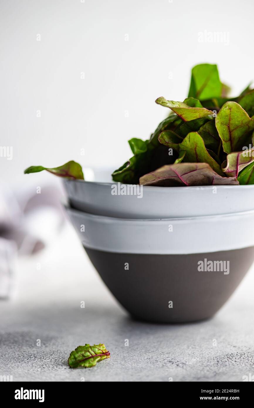 Beetroot leaves in ceramic bowls Stock Photo