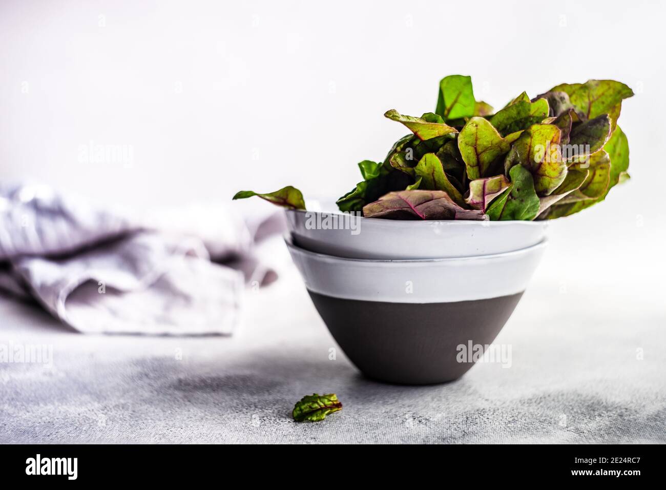Beetroot leaves in ceramic bowls Stock Photo
