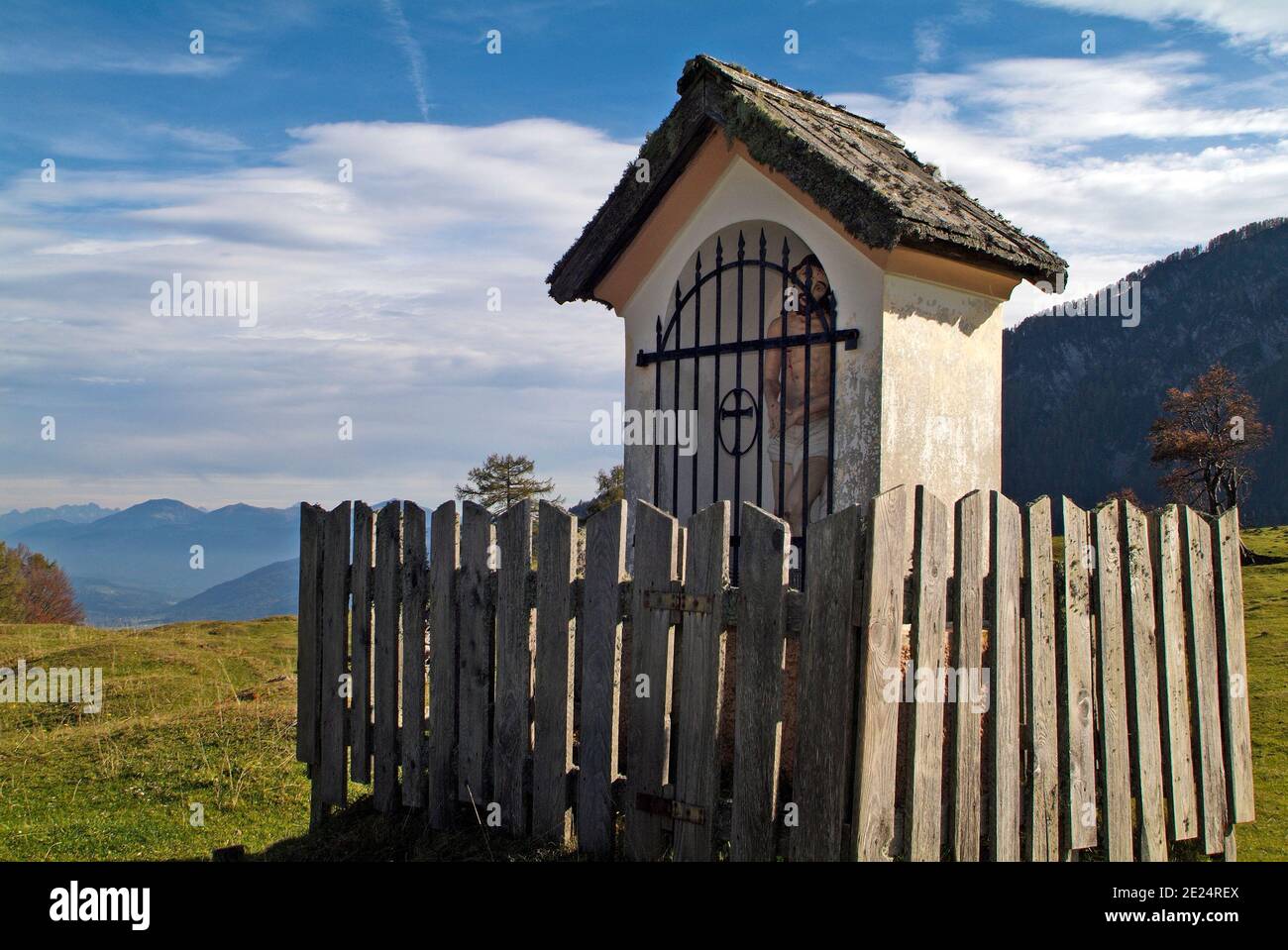 Austria, wayside shrine on Waisacher Alm with view to Carinthian alps Stock Photo