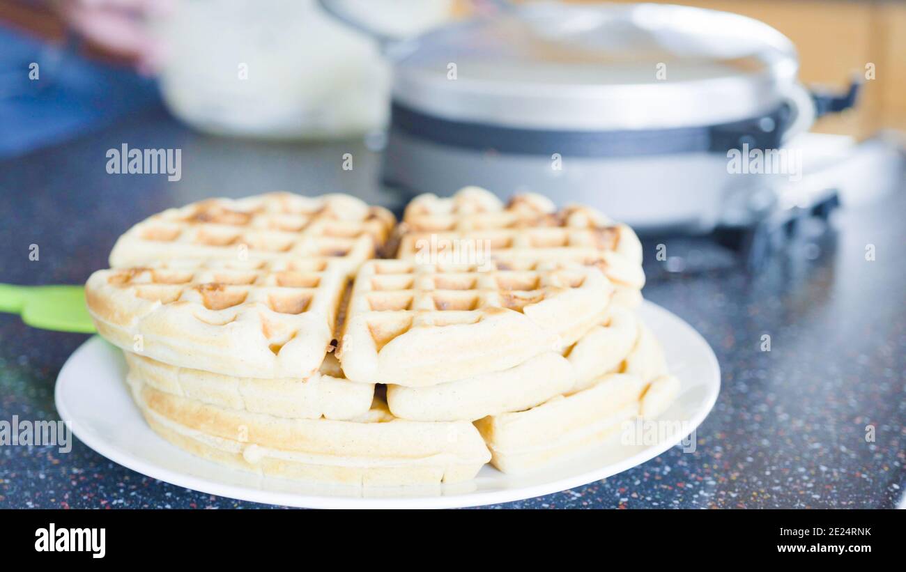 Making homemade waffles in an electric waffle maker Stock Photo Alamy