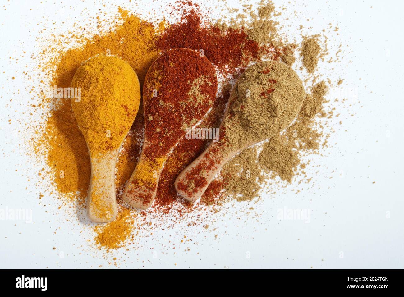 Three spices. Paprika, Turmeric and Cumin on a white background Stock