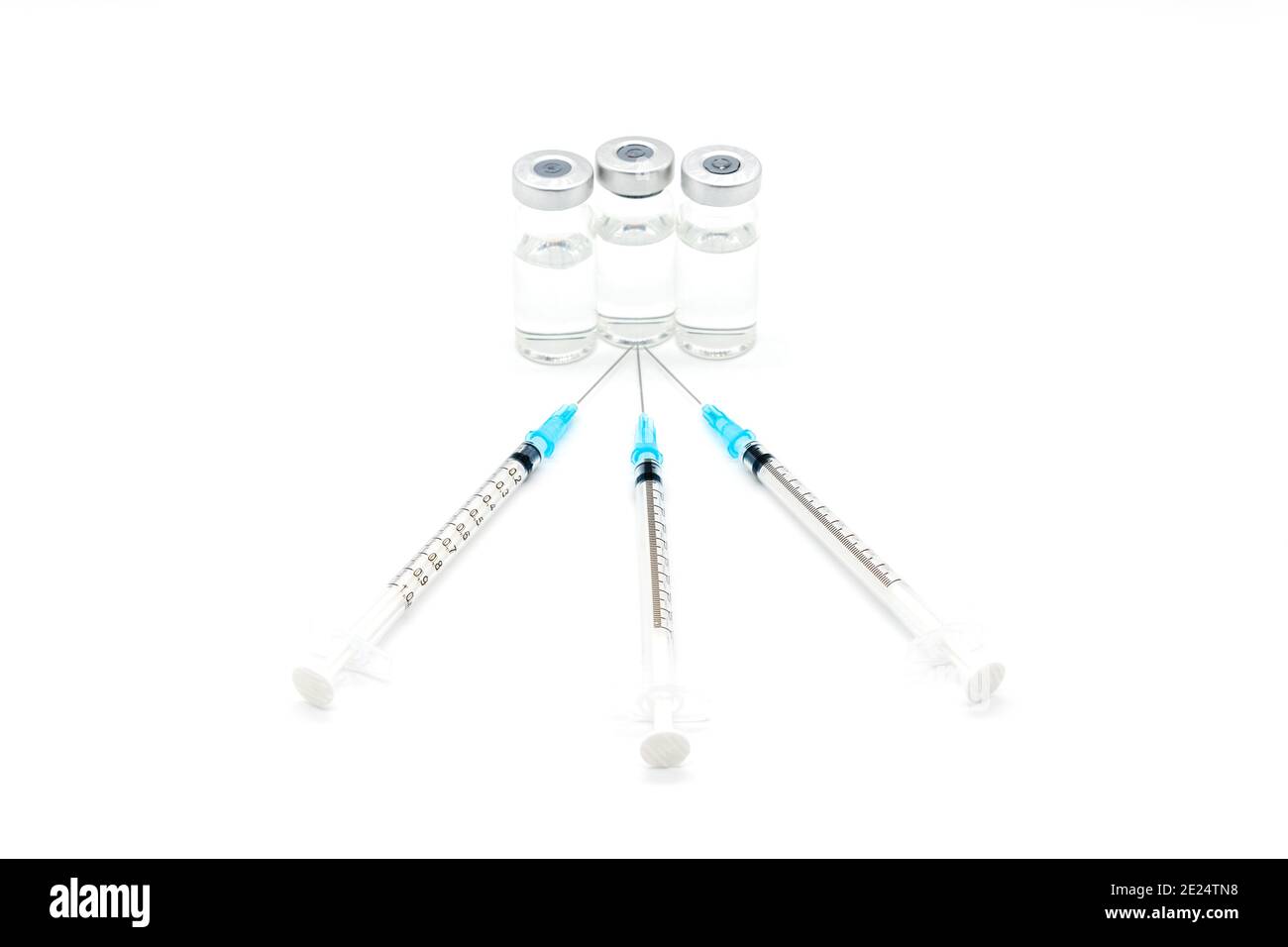 Medical syringes and needles for hypodermic injection on a marble counter top. The syringe and